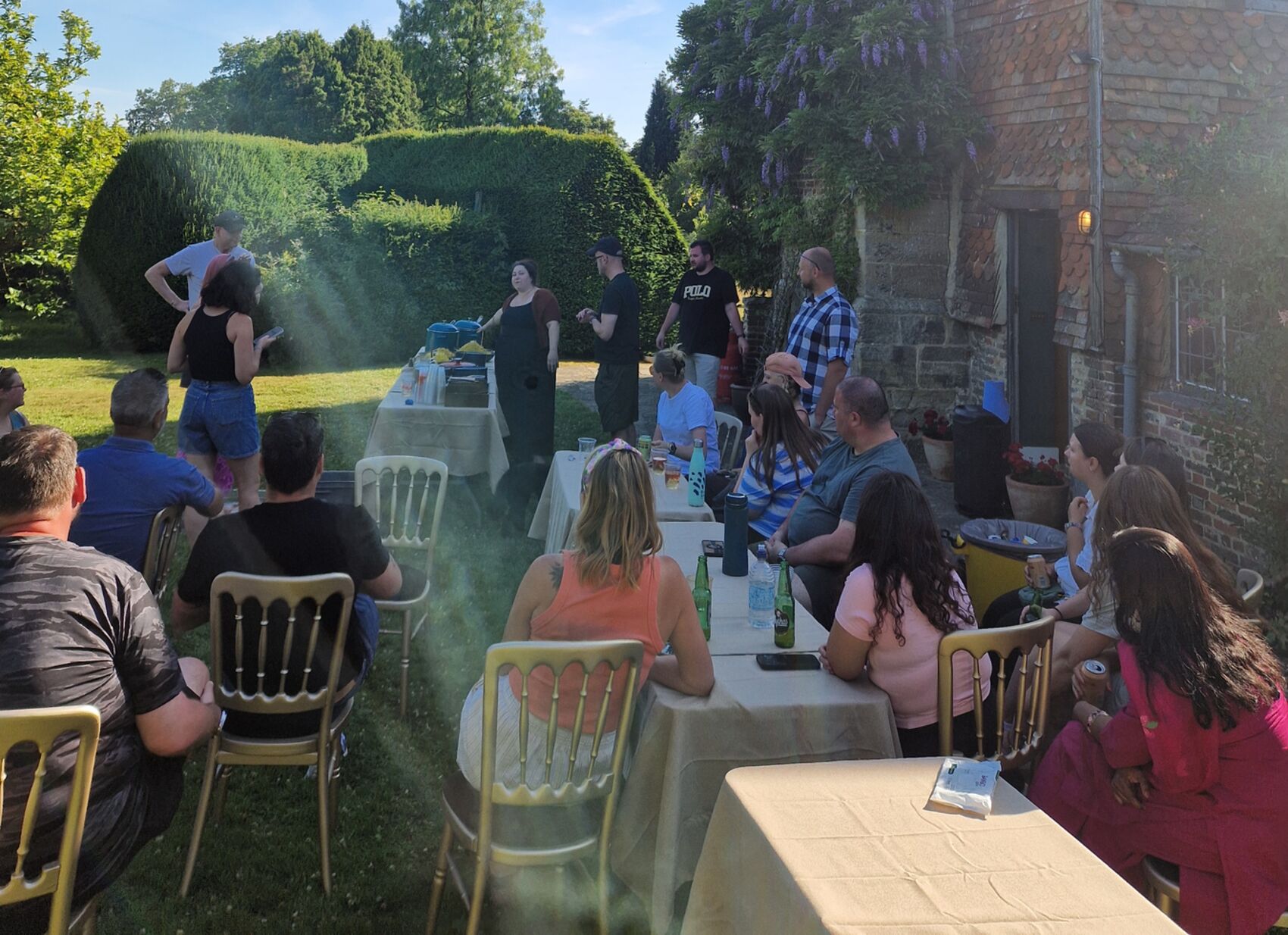 A long table laid for dinner at dusk